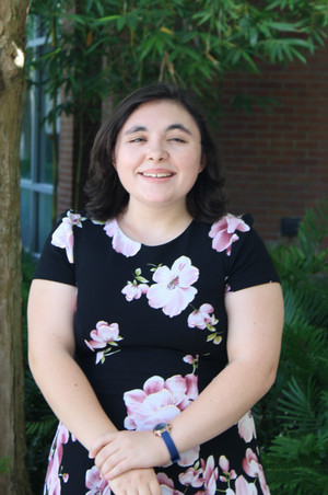 Headshot of OIC marketing coordinator Aribelle barre