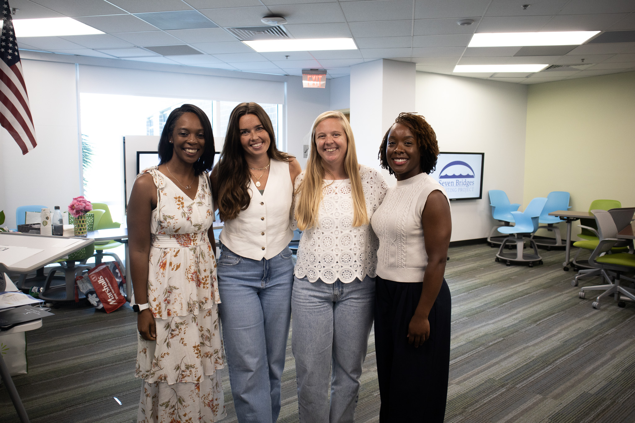 A group of teachers stand with the keynote speaker, Jessica McLin.