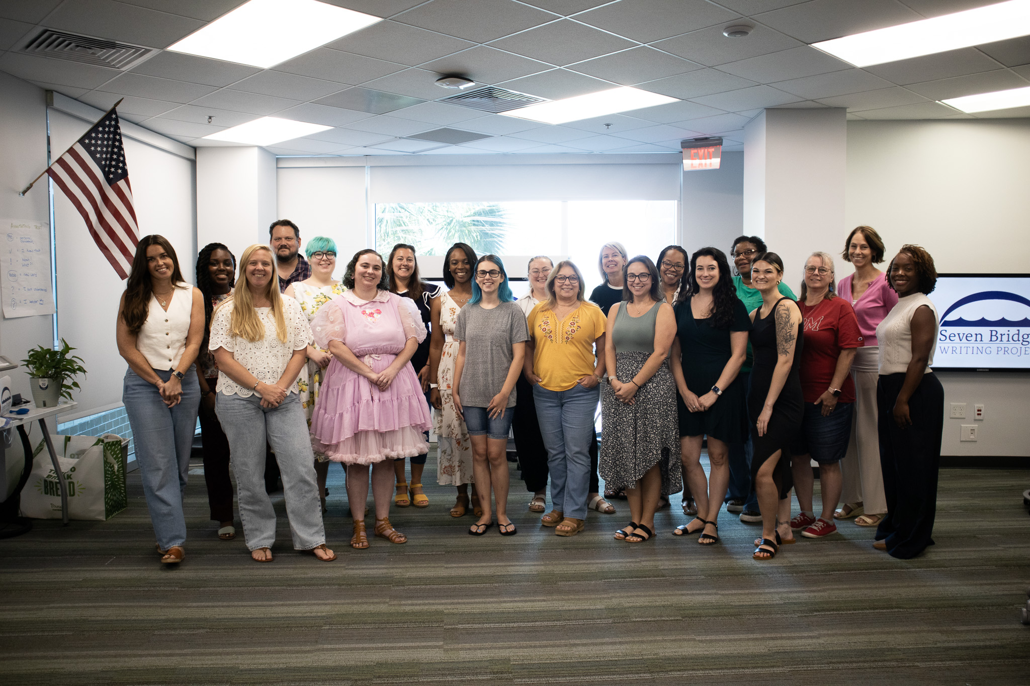 A group of writing teachers and faculty members stand together during the Summer Institute.