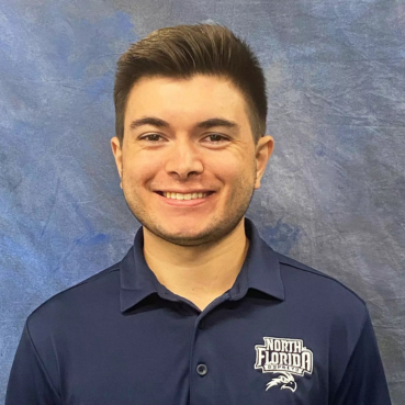Headshot of Ian Bolger wearing a navy UNF polo 