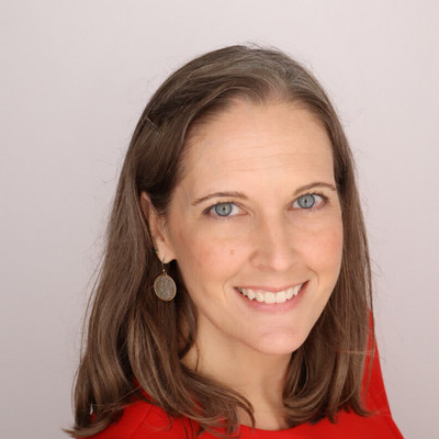 Melinda Morrow with shoulder-length brown hair and red shirt