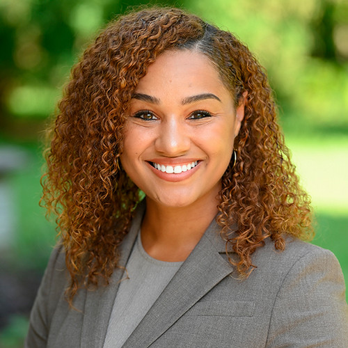 Shadia Blair headshot in grey suit