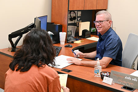 an advisor talking with a student