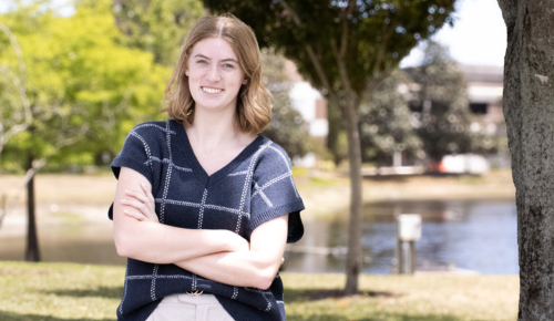 Molly Springer smiles while standing on the UNF campus.