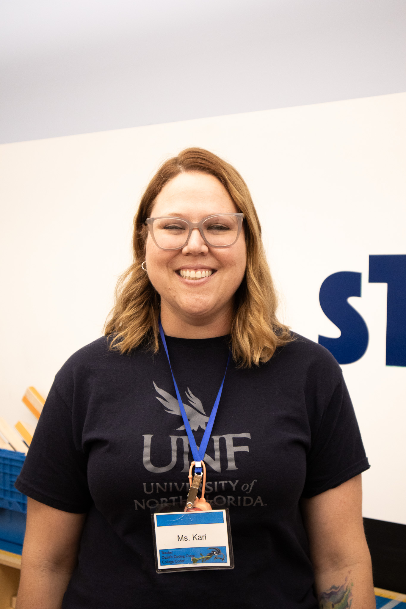 Teacher, Kari, smiles in the STEP Lab. 