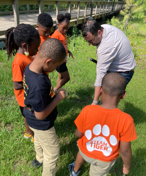 Xavier and Tiger Students looking at Soil