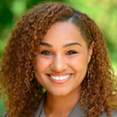 Shadia Blair headshot in grey suit