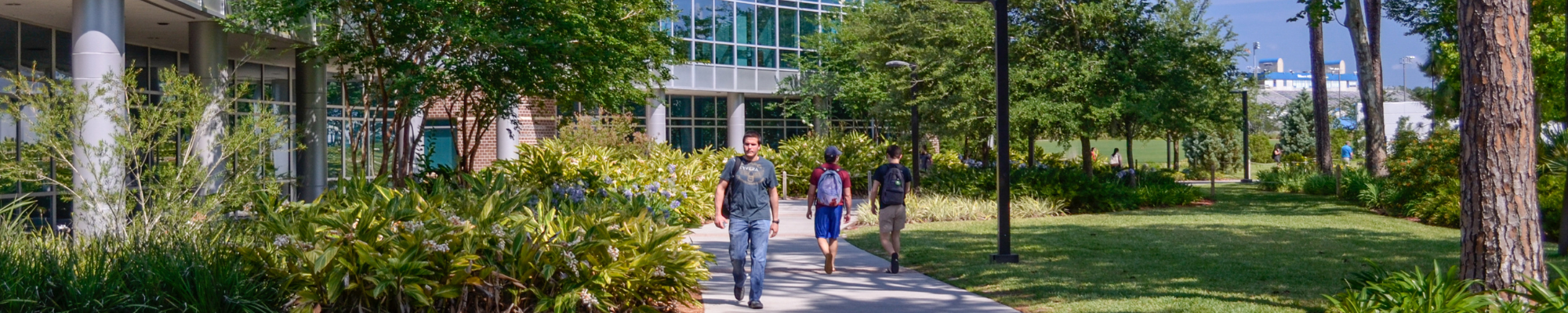 Students walking outside of COEHS building