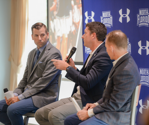 Athletic Administrators and coaches at a press conference