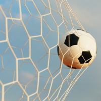 Soccer ball kicked into net with blue sky