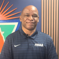 Headshot of Craig Damon in navy polo