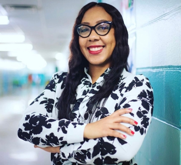 Professional headshot of Dione Thomas Webber