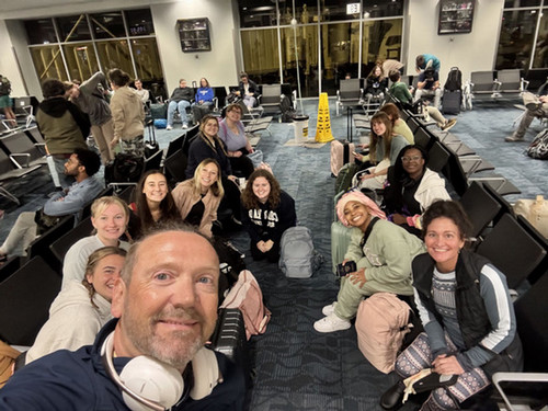 A selfie taken by Dr. Winterbottom of UNF faculty and students at the airport 