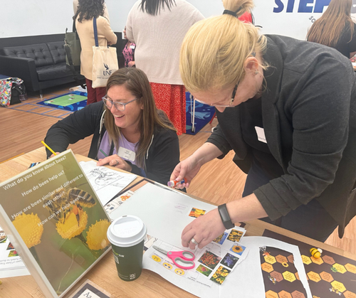 Two attendees taking part in a Bee project in the UNF STEP Lab