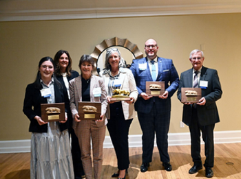 Dr. Diane Yendol-Hoppey accepting Penn State award with five other recipients