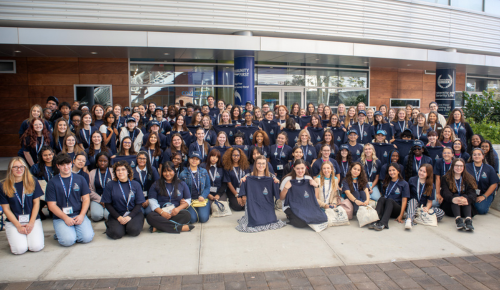Group photograph of high school students wearing their FEA conference shirts at UNF 