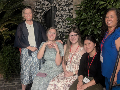 Dr. Caroline Guardino smiling with UNF students in Italy