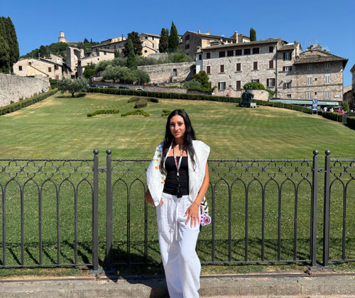 Leyla Salinas standing outside near Italian village