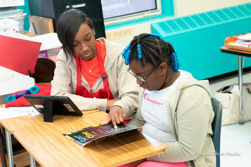 Read USA female tutor and student reading 