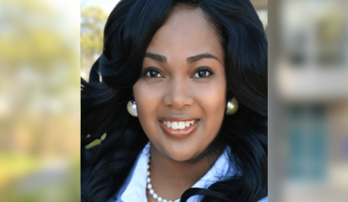 Headshot of Raven Robinson-Wilson with blurred background