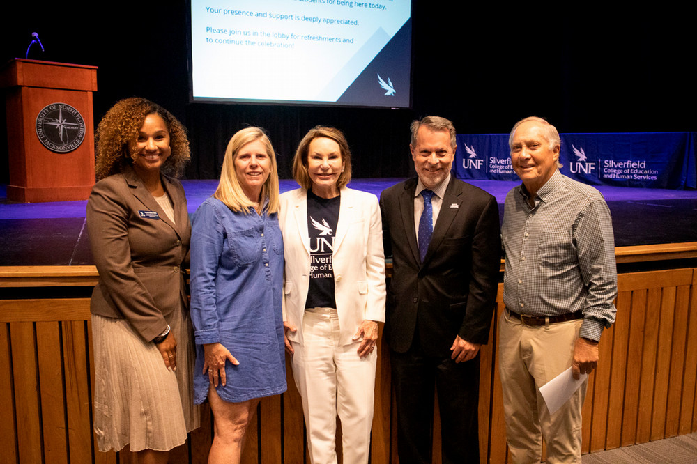 The Silverfields pose with Dean, Associate Dean, and Director of Development