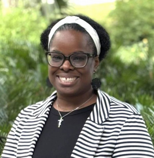 Headshot of Marlena Jenkins wearing black and white outfit