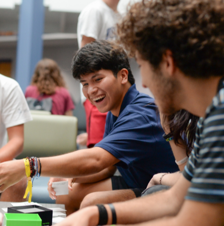 UNF students playing card games and smiling