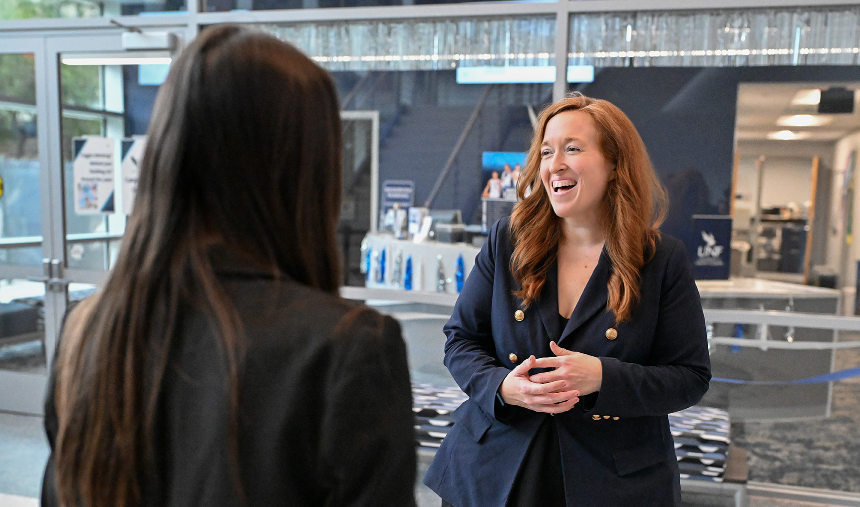 Admissions Team chatting in UNF building