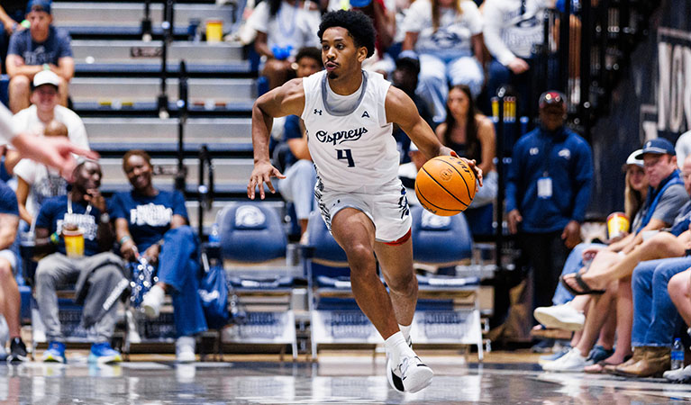 Basketball player dribbling the ball on the court