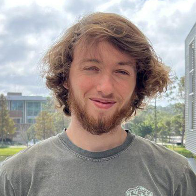 Max in a grey shirt outside the student union