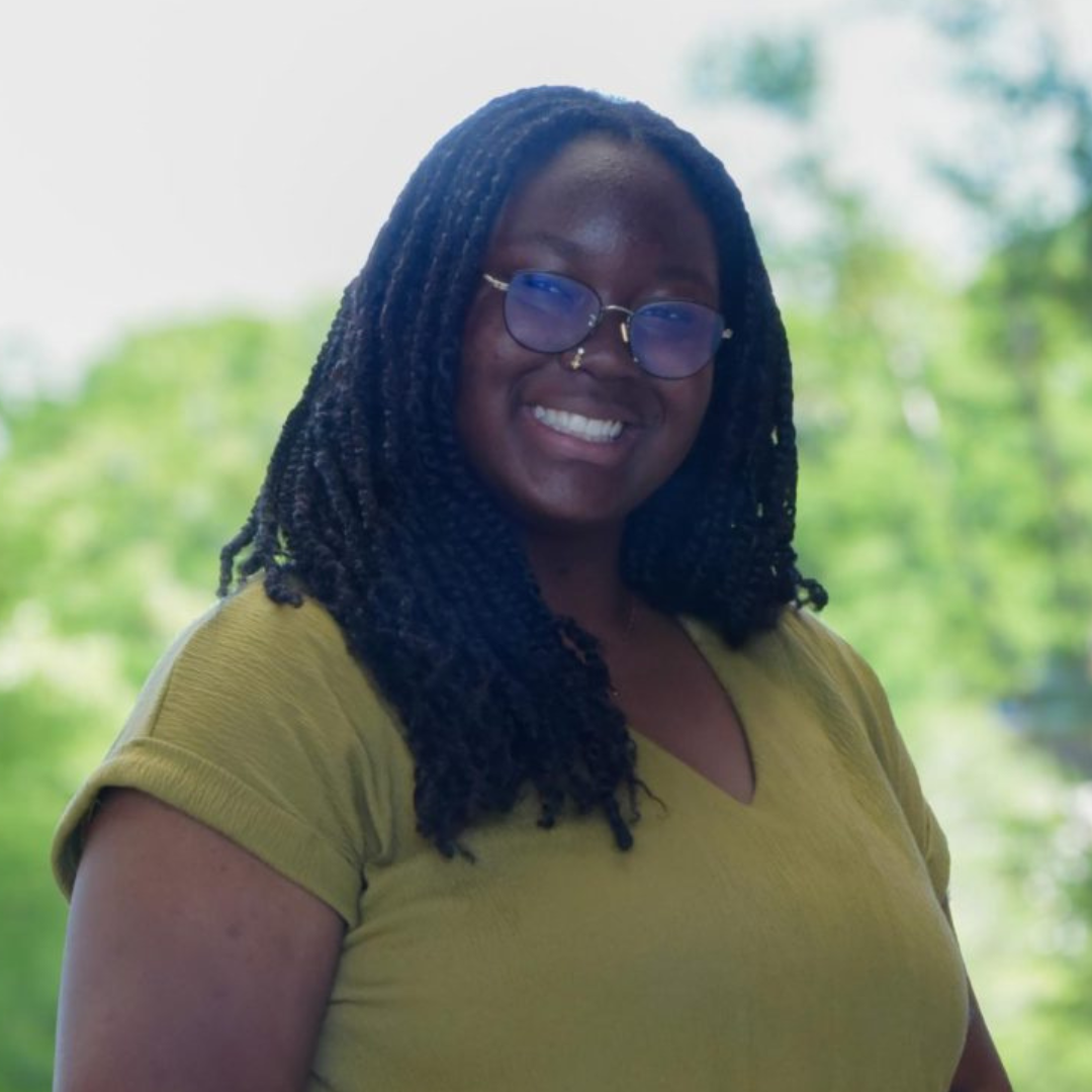 Osaremen is wearing a green shirt and glasses