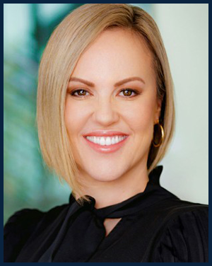 A woman smiling for a professional headshot.