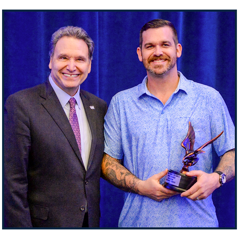 David Main winning an award
