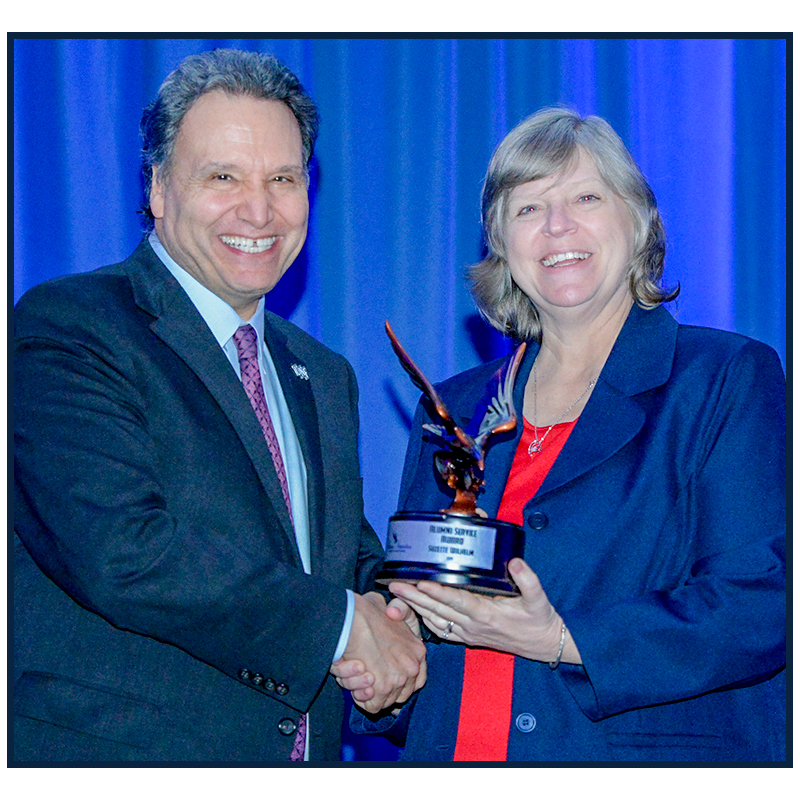 Suzette winning an award