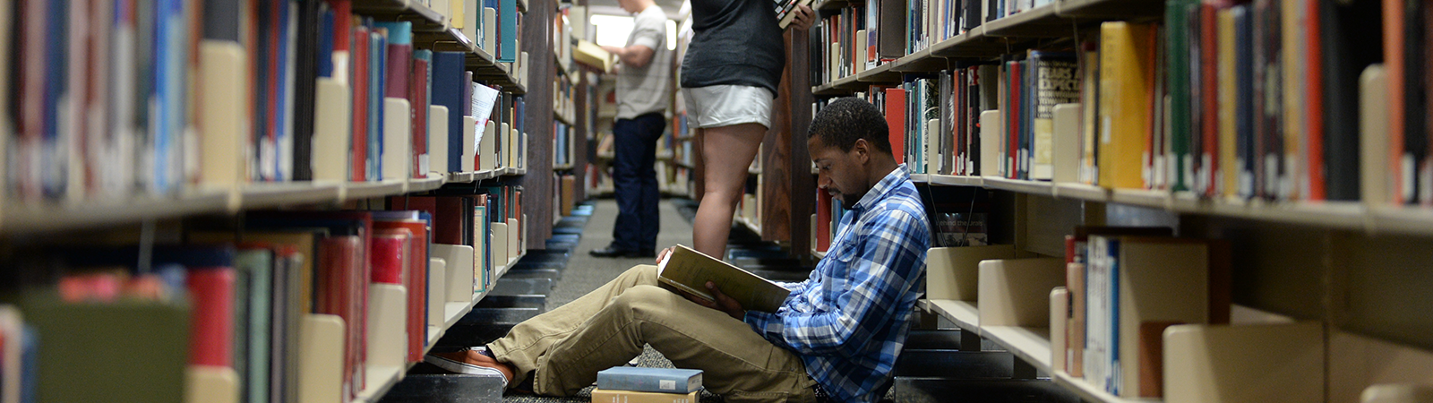 Student In Library (Scholarship Folder)