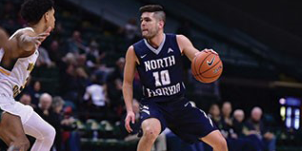 Alumnus John Barrett as a basketball student athlete