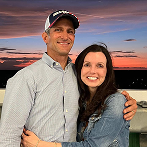 Headshot of Greg Motto and his wife