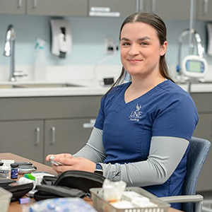 Photo of Katie Lewis in UNF scrubs