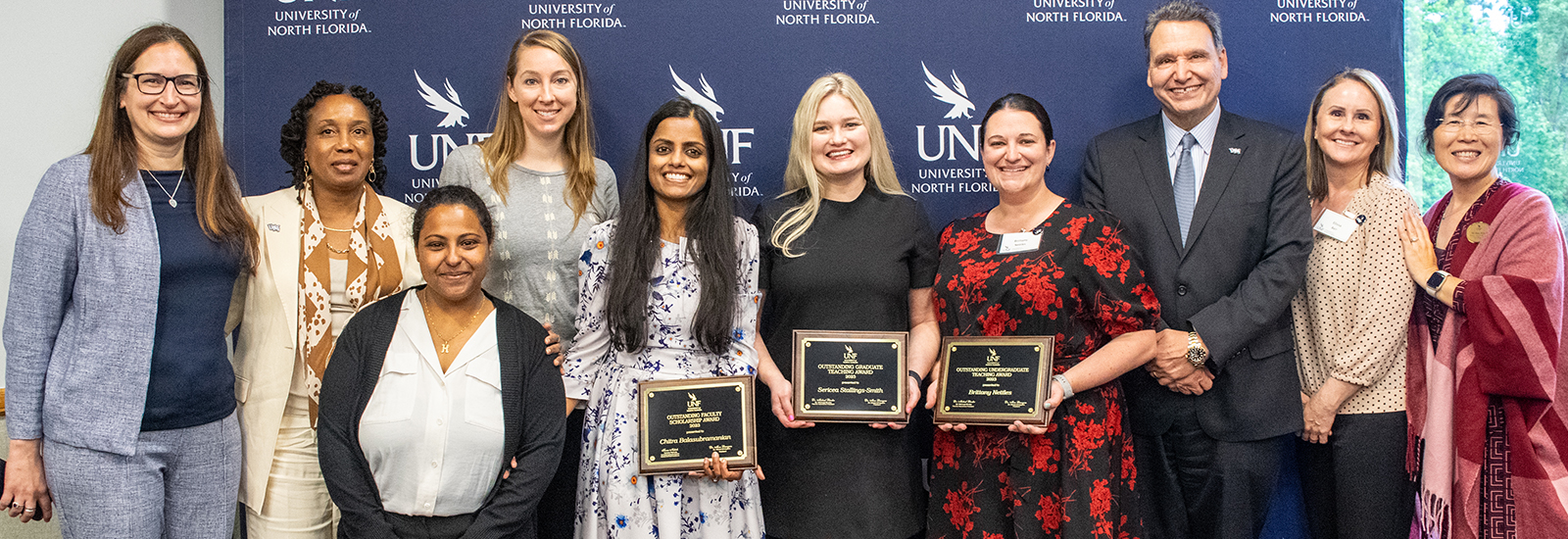 Faculty awards with awardees posing with plaques