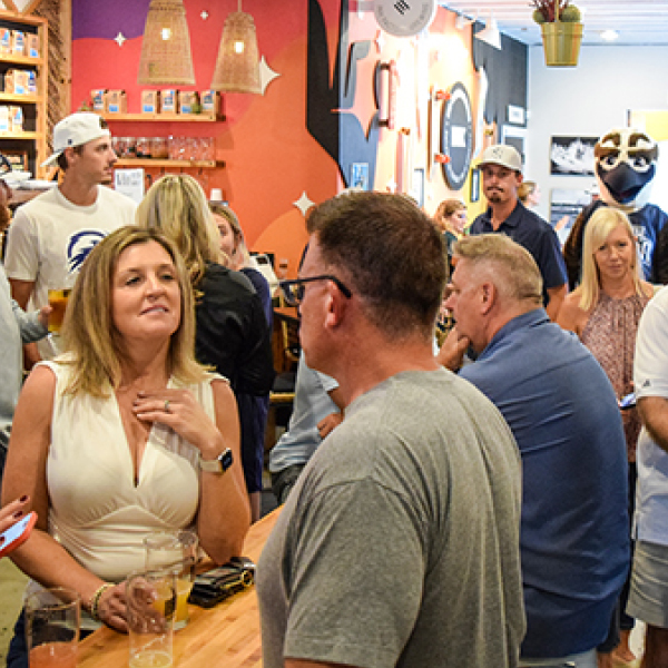 People gathering at a bar