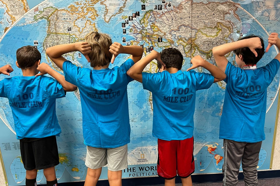 Coppergate students looking at a map after joining the 100 mile club