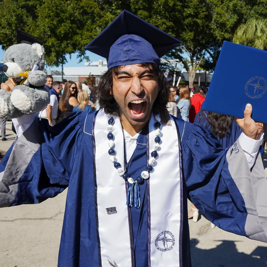 UNF graduate with diploma