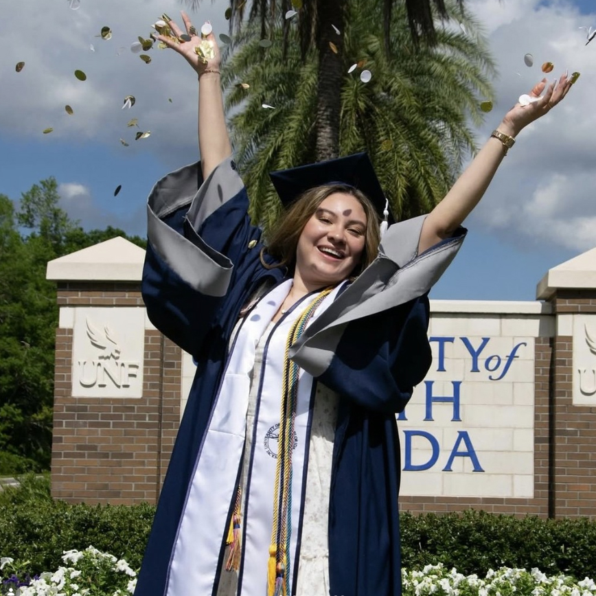 UNF student celebrating graduating
