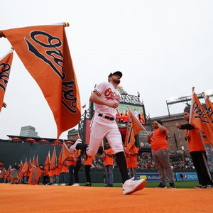 Bryan Baker running onto field through flags