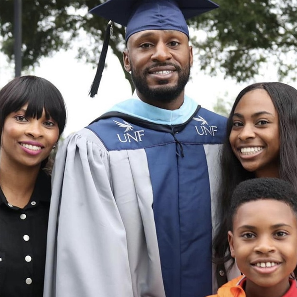 drayton in his regalia posing with his family
