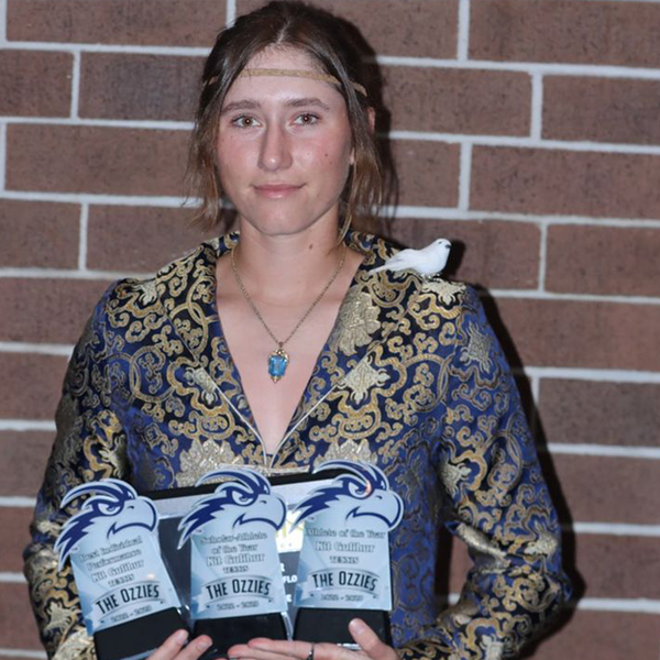 kit holidng up three ozzie awards