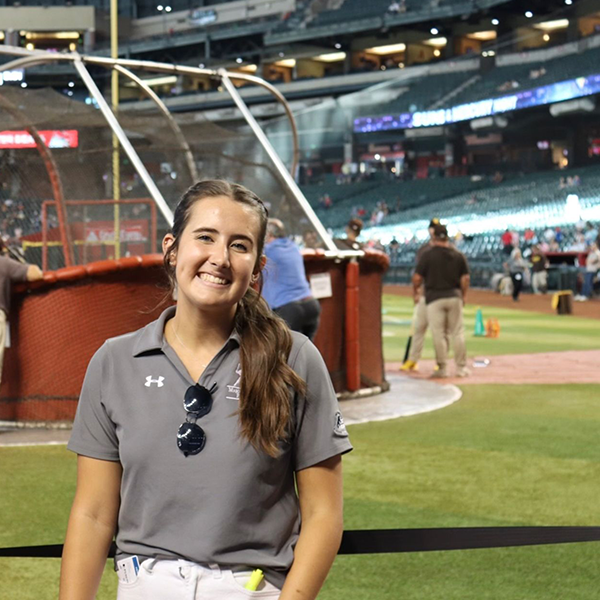 madison outside a baseball bullpen 