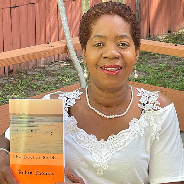 thomas holding up her book the doctor said
