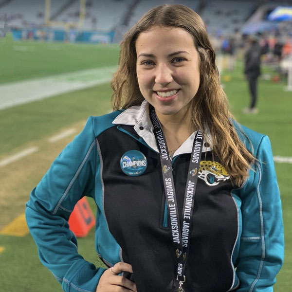 celia in her jags uniform on the sidelines