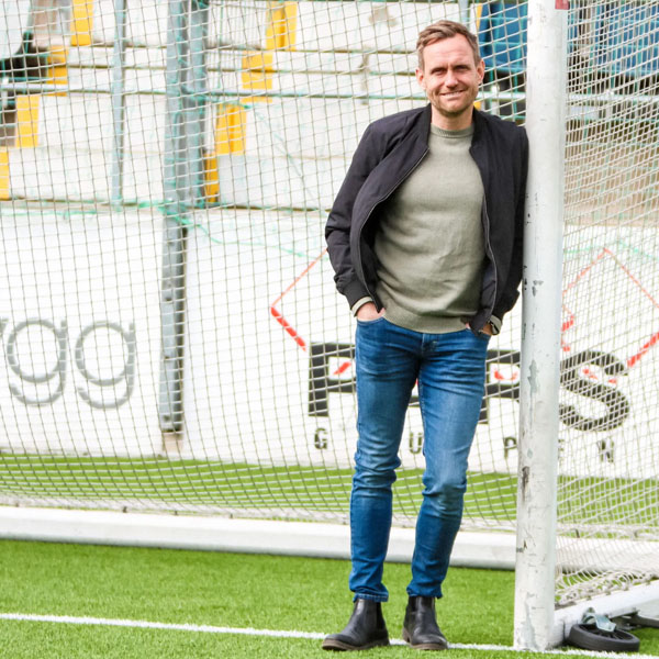 martin leaning against a soccer goal